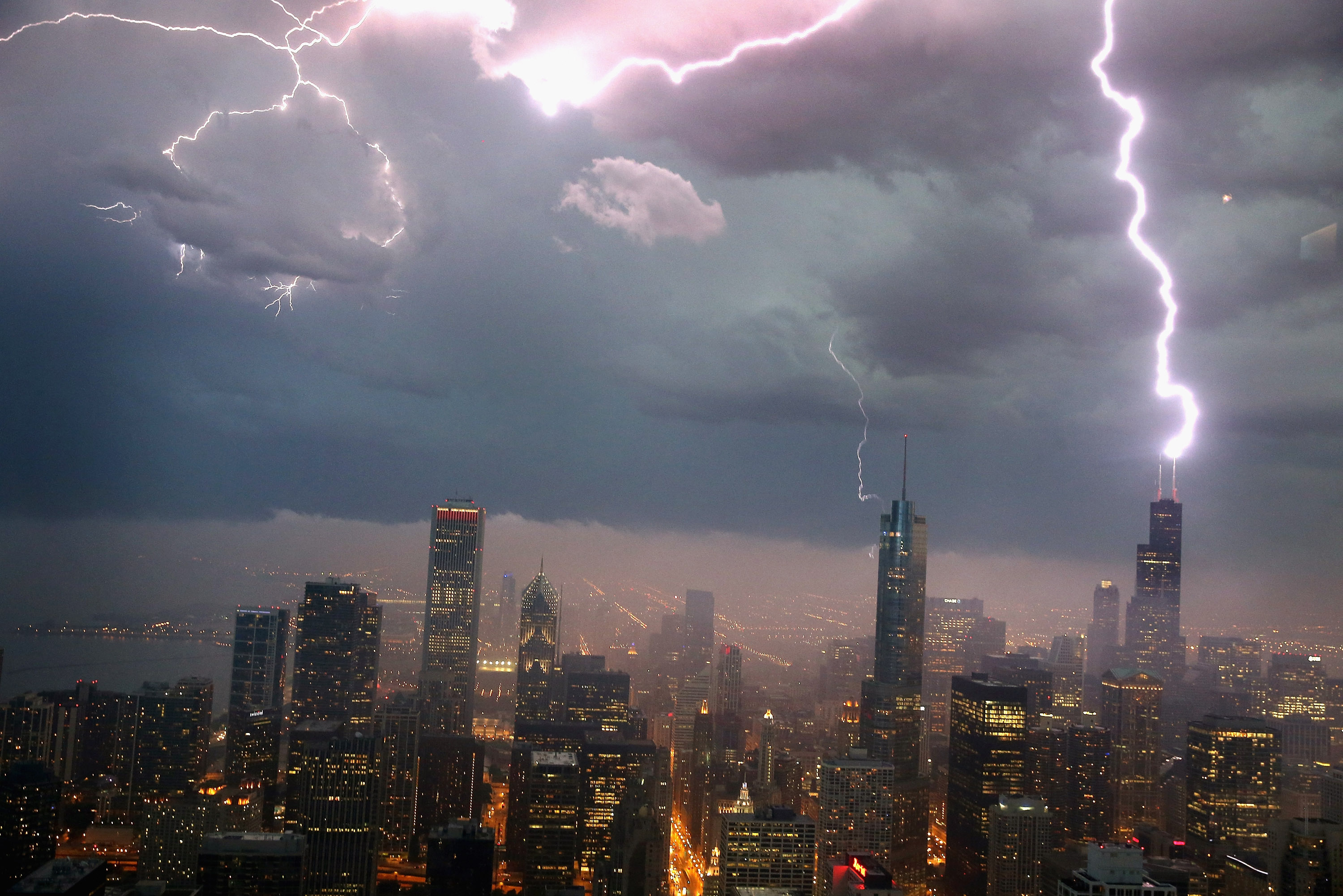 CHICAGO, IL - JUNE 12:  Lightning strikes the Willis Tower (formerly Sears Tower) in downtown on June 12, 2013 in Chicago, Illinois. A massive storm system with heavy rain, high winds, hail and possible tornadoes is expected to move into Illinois and much of the central part of the Midwest today.  (Photo by Scott Olson/Getty Images)