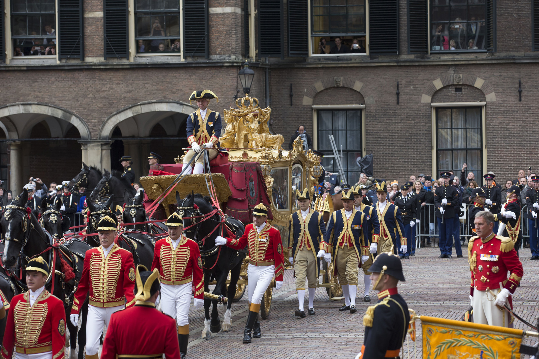 The golden chariot arrives carrying King Willem-Alexander and Queen Maxima of The Netherlands arrives at the Ridderzaal during celebrations for Prinsjesdag (Prince's Day) on September 17, 2013 in The Hague, Netherlands. (Photo by Michel Porro/Getty Images) 