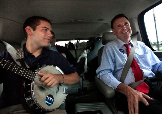 Democratic gubernatorial candidate Creigh Deeds spends time with his son, Gus, left, on the road to Halifax, Va., between campaign events in 2009.(Photo: Hyunsoo Leo Kim, AP)