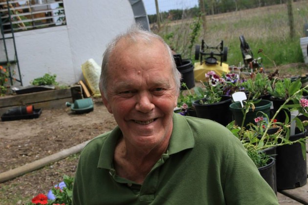 Win Borden in his element -- the garden -- in May 2013. Photo by Joey Halvorson.