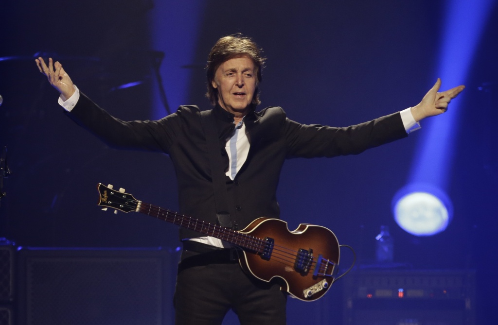 Paul McCartney performs during the first U.S concert of his "Out There" tour, in Orlando, Fla.  AP Photo/John Raoux, File.