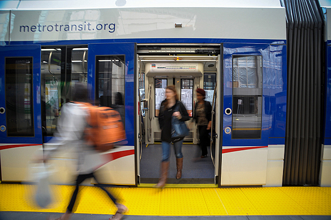 Passengers get off the light rail in downtown Minneapolis on Friday, May 16, 2014. | Caroline Yang / For MPR News