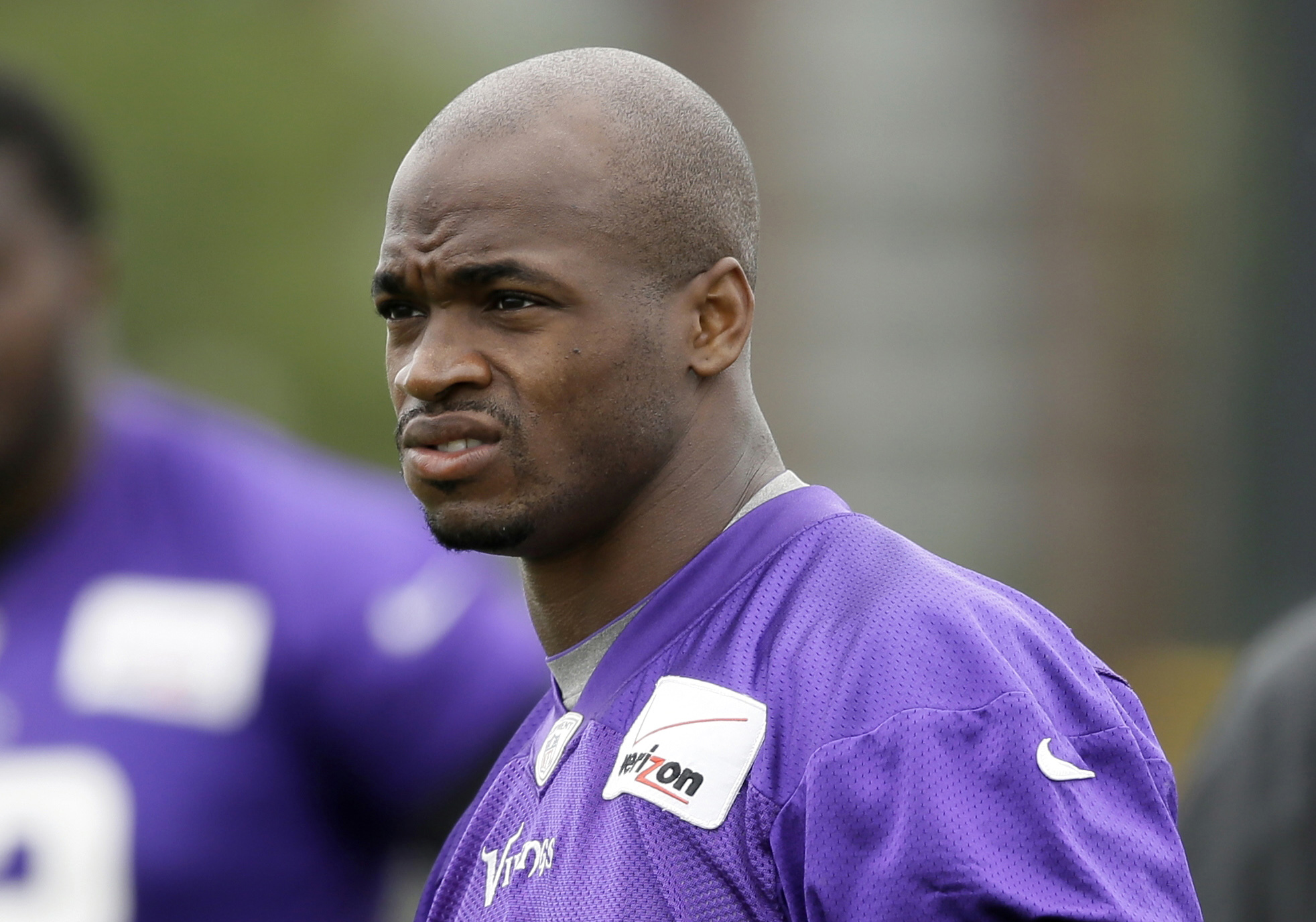   In this July 28, 2014, file photo, Minnesota Vikings running back Adrian Peterson looks on during NFL football training camp in Mankato.  (AP Photo/Charlie Neibergall, File)