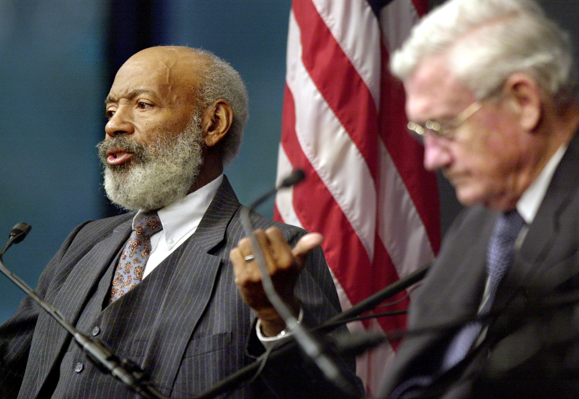 James Meredith, left, speaks to the audience as former Justice Department attorney John Doar, right, looks on during a forum in Boston in 2002. It was the last time Doar and Meredith saw each other. (AP Photo/Steven Senne)