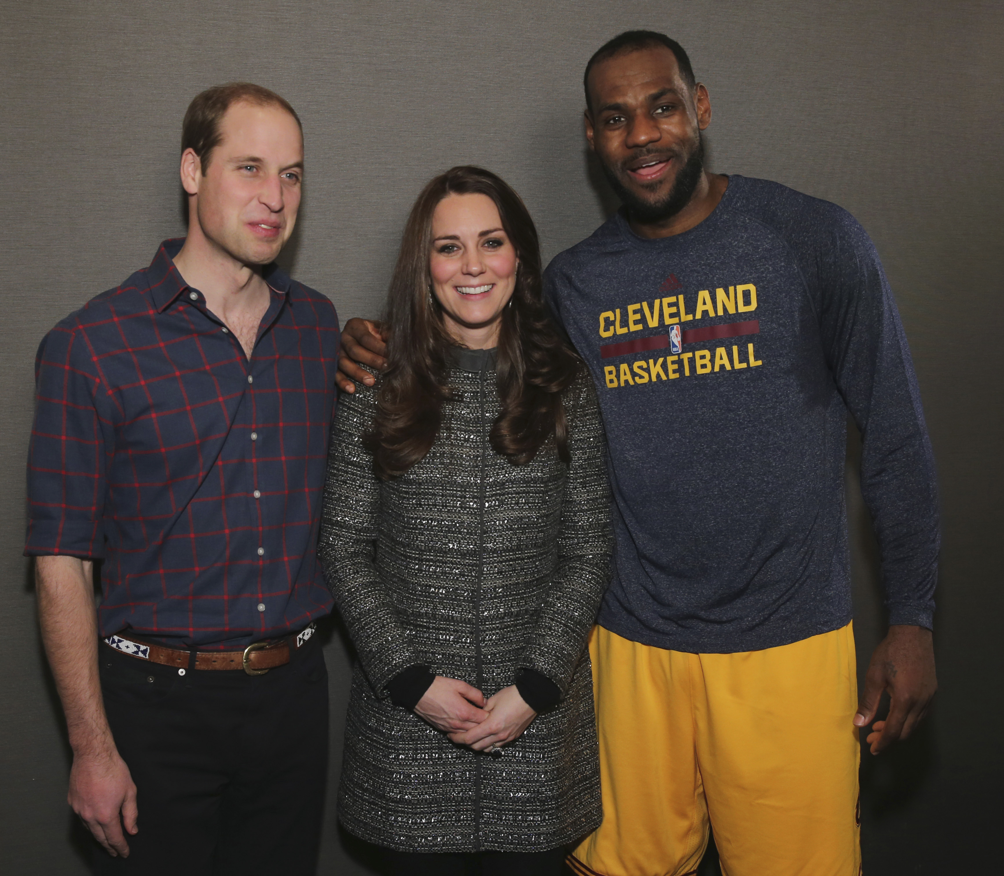 Britain's Prince William, left, and Kate, Duchess of Cambridge pose with Cleveland Cavaliers' LeBron James, right, backstage of an NBA basketball game between the Cavaliers and the Brooklyn Nets on Monday, Dec. 8, 2014, in New York. (AP Photo/Neilson Barnard, Pool)