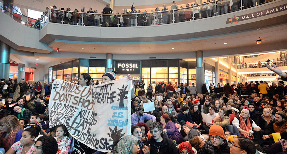 Demonstrators filled the Mall of America rotunda and chanted "Black lives matter" to protest police brutality, then staged a "die-in." Aaron Lavinsky / The Star Tribune via AP