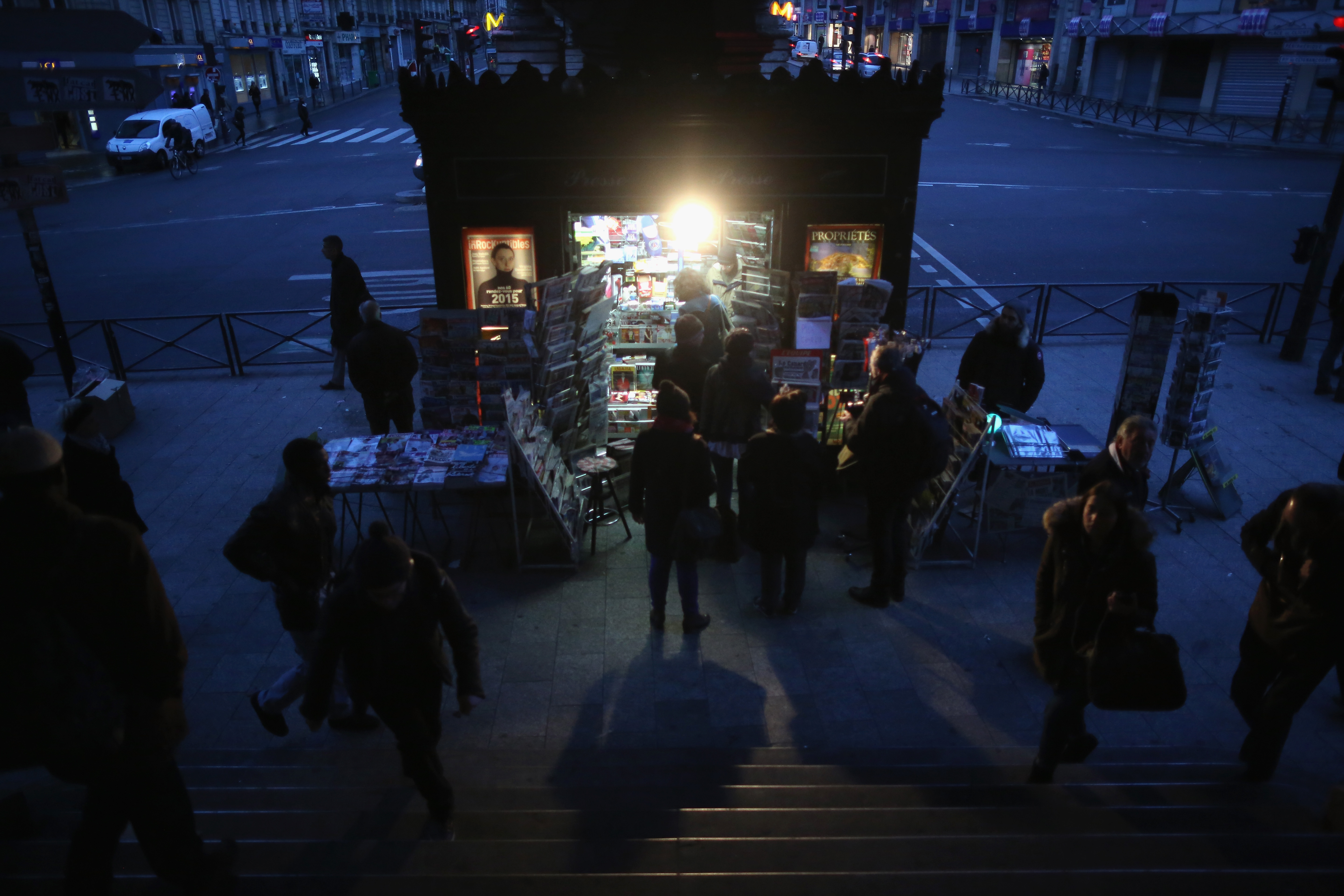 Parisians queue at a newspaper kiosk to get their copies of the latest edition of Charlie Hebdo magazine  on January 14, 2015 in Paris, France. Three million copies of the controversial magazine have been printed  in the wake of last weeks terrorist attacks. (Getty Images)