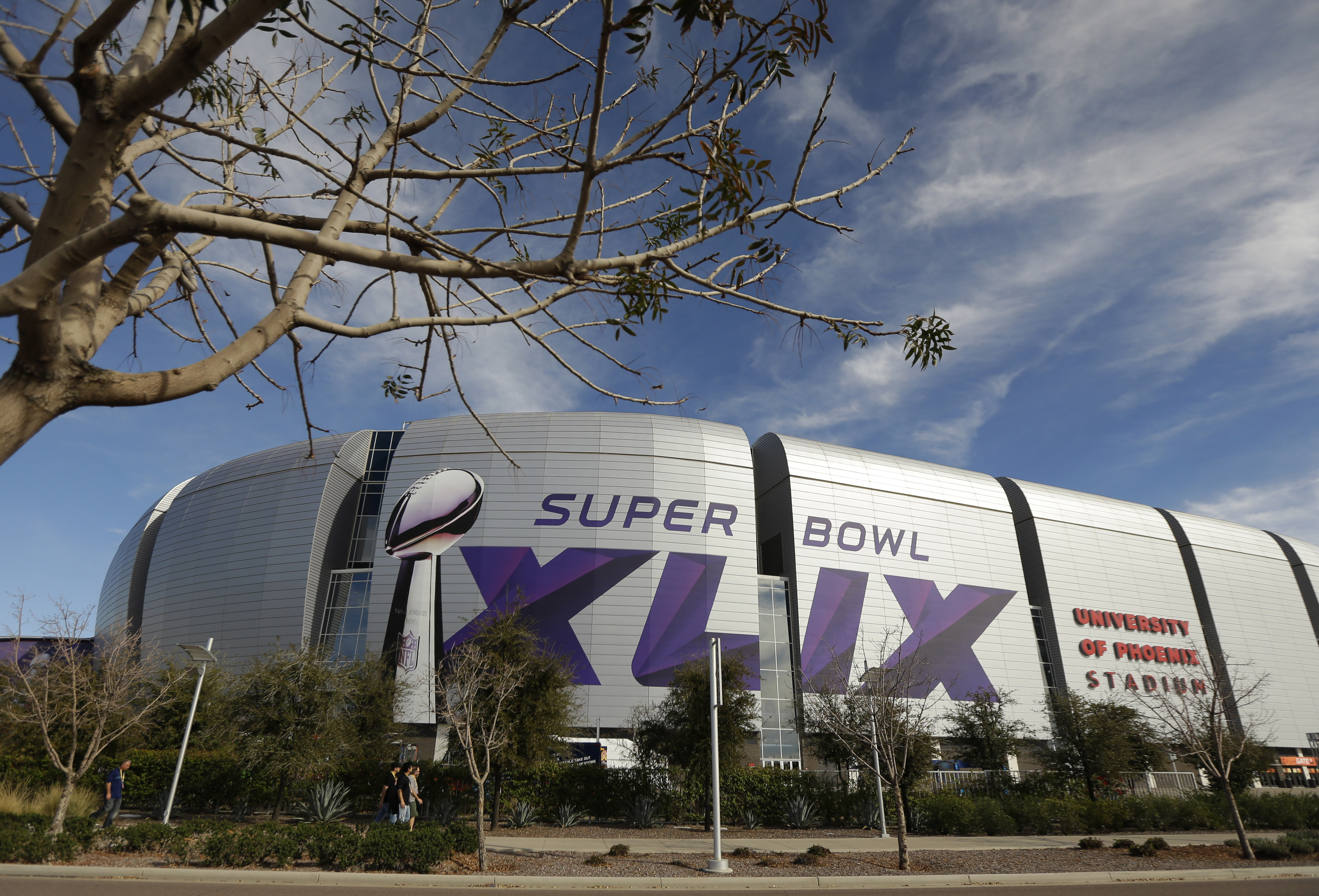 The Super Bowl XLIX logo is displayed on the University of Phoenix Stadium before the Pro Bowl Sunday, Jan. 25, 2015, in Glendale, Ariz. The venue will also host Super Bowl XLIX between the New England Patriots and the Seattle Seahawks on Sunday, Feb. 1, 2015. (AP Photo/Charlie Riedel)