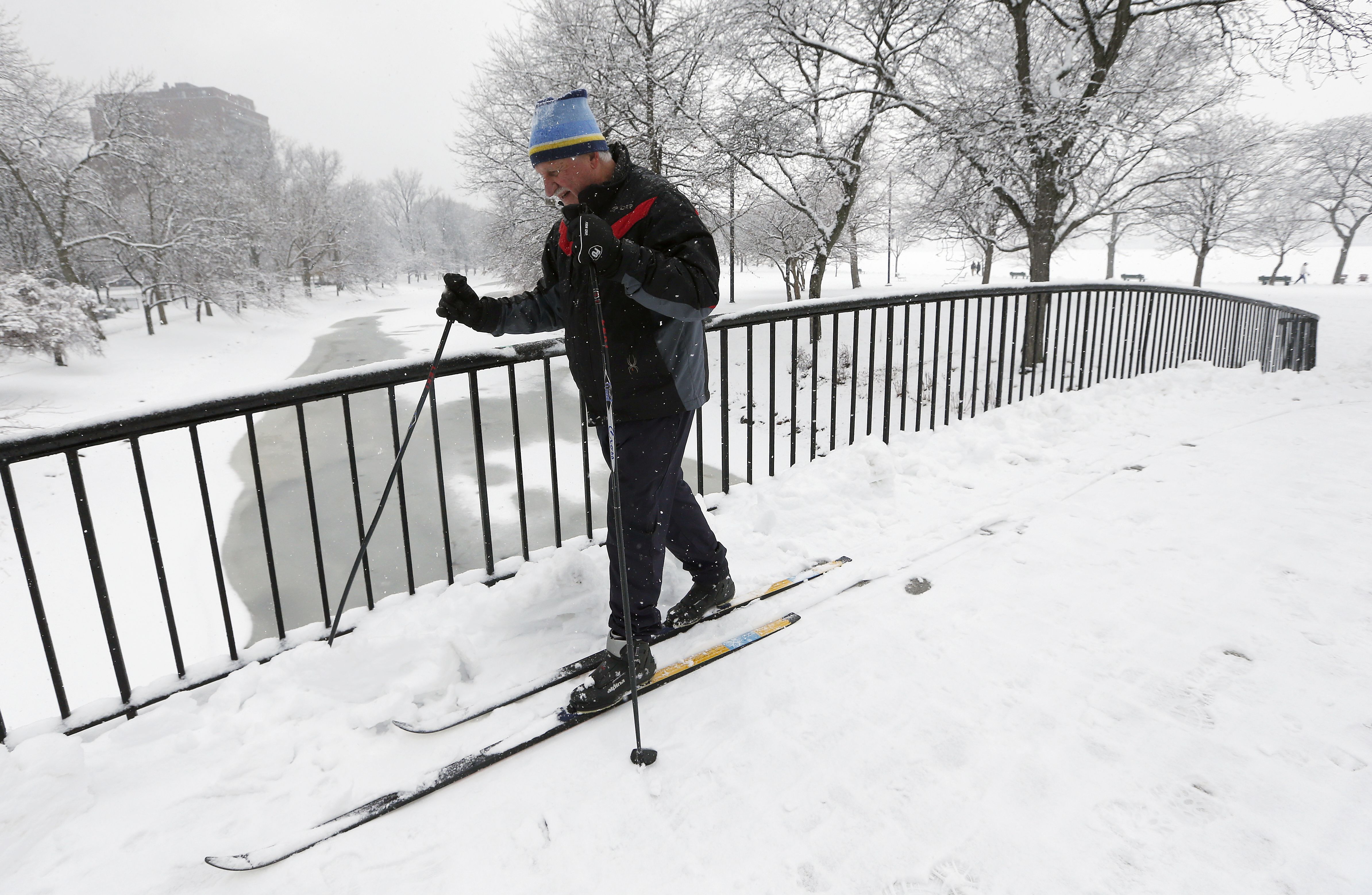 Irv Rosenberg, of Boston, uses cross country skis on the Esplanade in Boston, Saturday, Jan. 24, 2015. A winter storm warning covering Boston and Hartford, Connecticut was in effect through 7 p.m. as the National Weather Service said to expect 4 to 8 inches of wet snow to fall by the time the storm moves out. (AP Photo/Michael Dwyer)