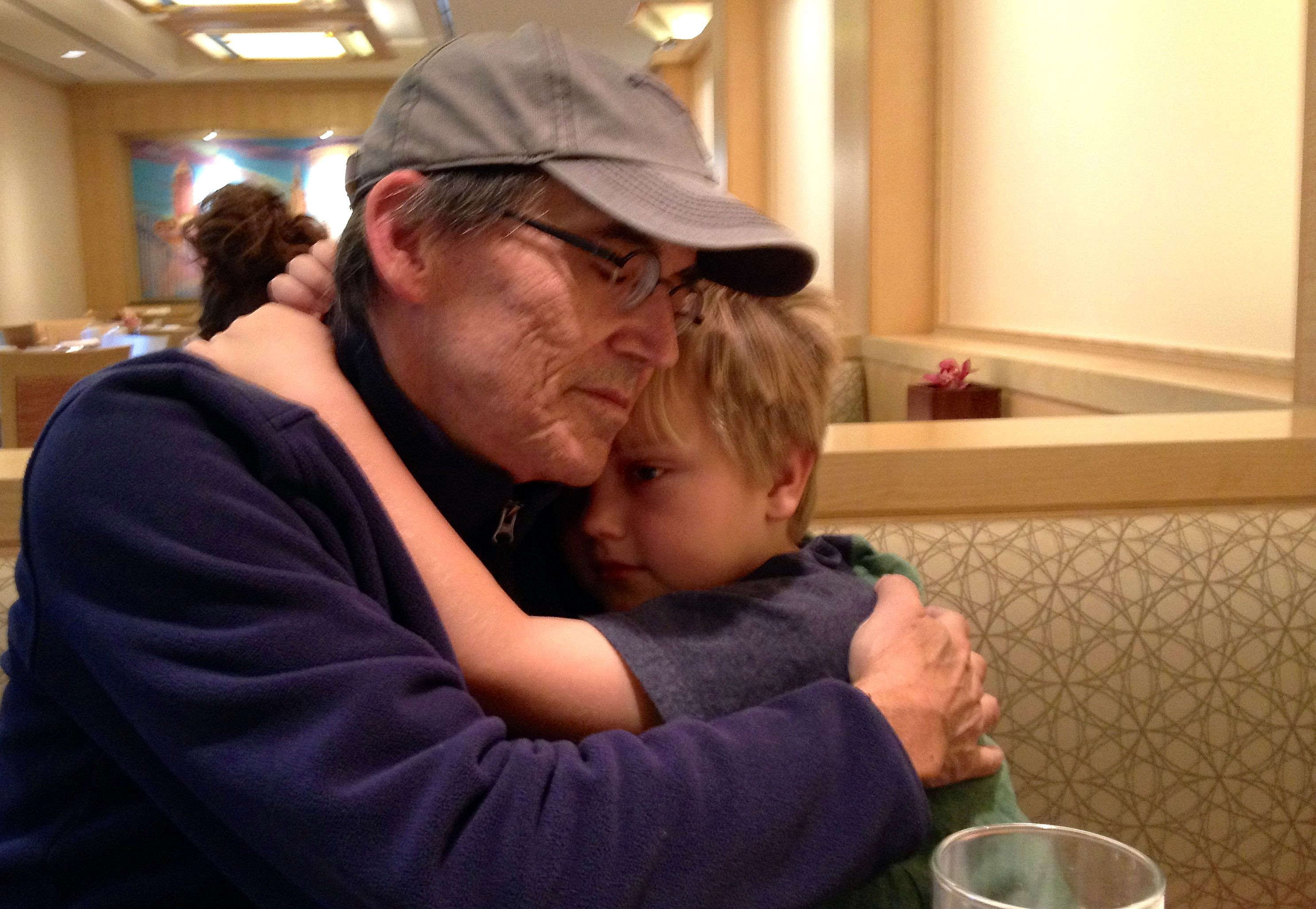 Joel Beeson and his youngest son, Joel, 7, at breakfast in the hotel before one of Mr. Beeson's procedures at the Cleveland Clinic, October, 2013. (Courtesy of Joel Beeson)