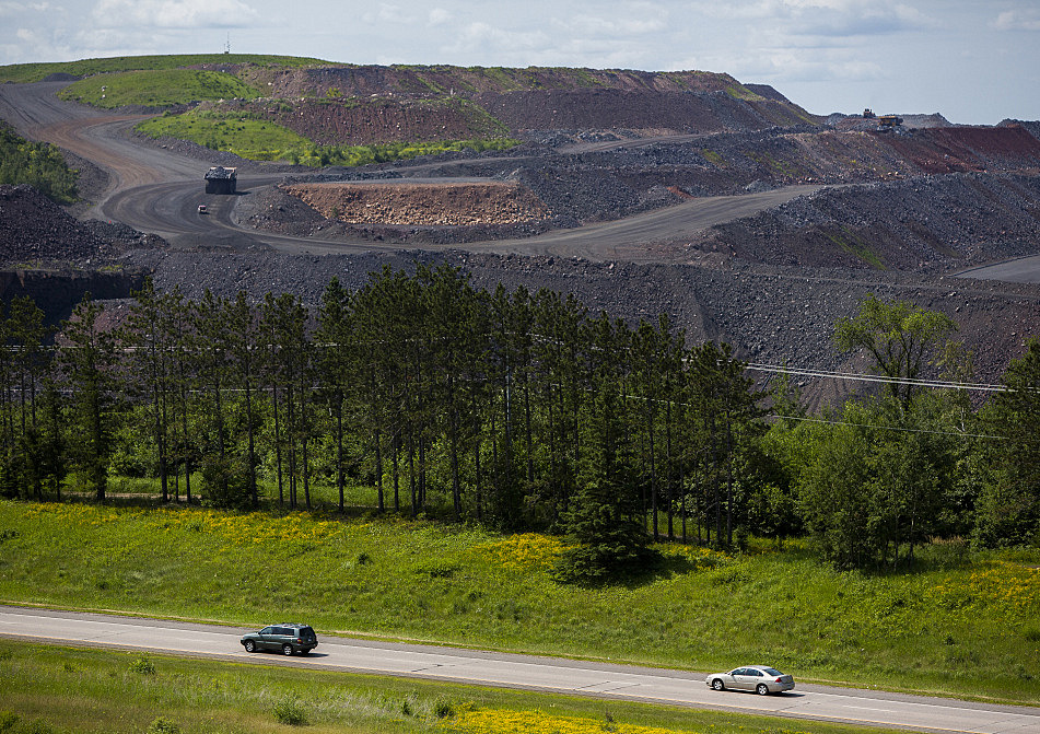 Vehicles head south on Highway 53 adjacent to United Taconite's mine Thursday, July 17, 2014 near Virginia, Minn. Derek Montgomery / For MPR News