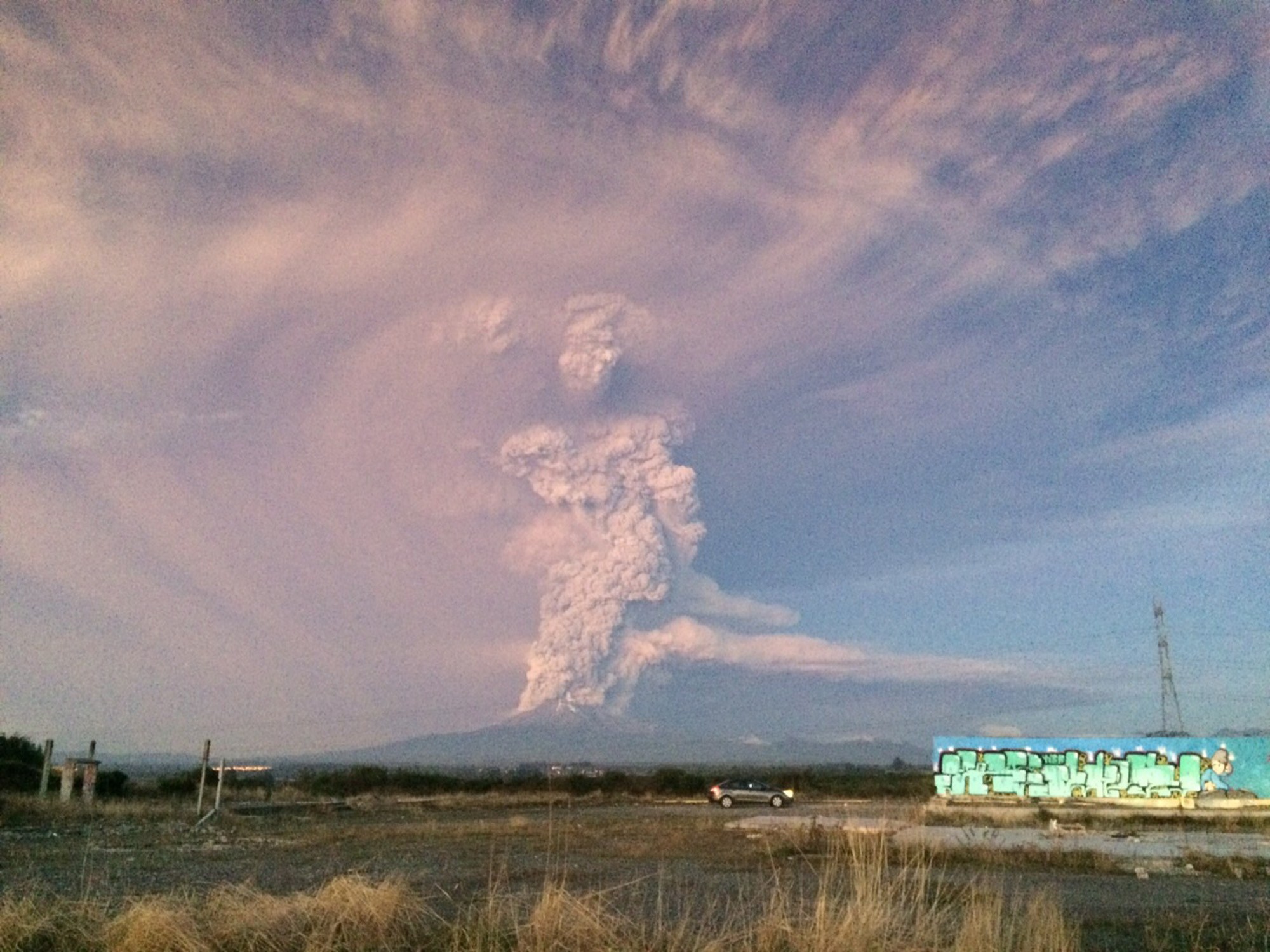 View from Puerto Varas, southern Chile, of a high column of ash and lava spewing from the Calbuco volcano, on April 22, 2015. Chile's Calbuco volcano erupted on Wednesday, spewing a giant funnel of ash high into the sky near the southern port city of Puerto Montt and triggering a red alert. Authorities ordered an evacuation for a 10-kilometer (six-mile) radius around the volcano, which is the second in southern Chile to have a substantial eruption since March 3, when the Villarrica volcano emitted a brief but fiery burst of ash and lava. AFP PHOTO/GIORDANA SCHMIDT/Getty Images.