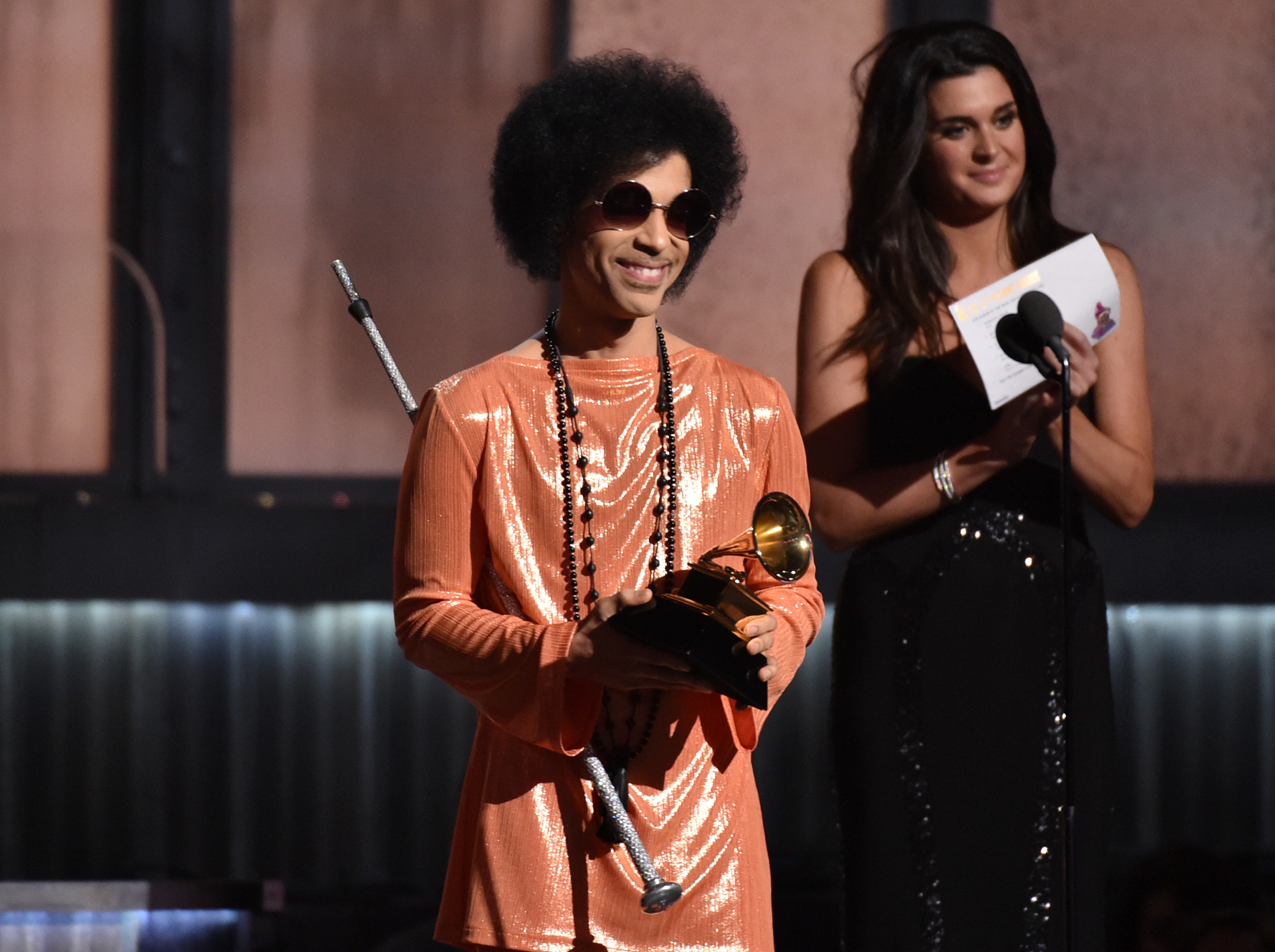 In this Feb. 8, 2015 file photo, Prince presents the award for album of the year at the 57th annual Grammy Awards in Los Angeles.  (Photo by John Shearer/Invision/AP)