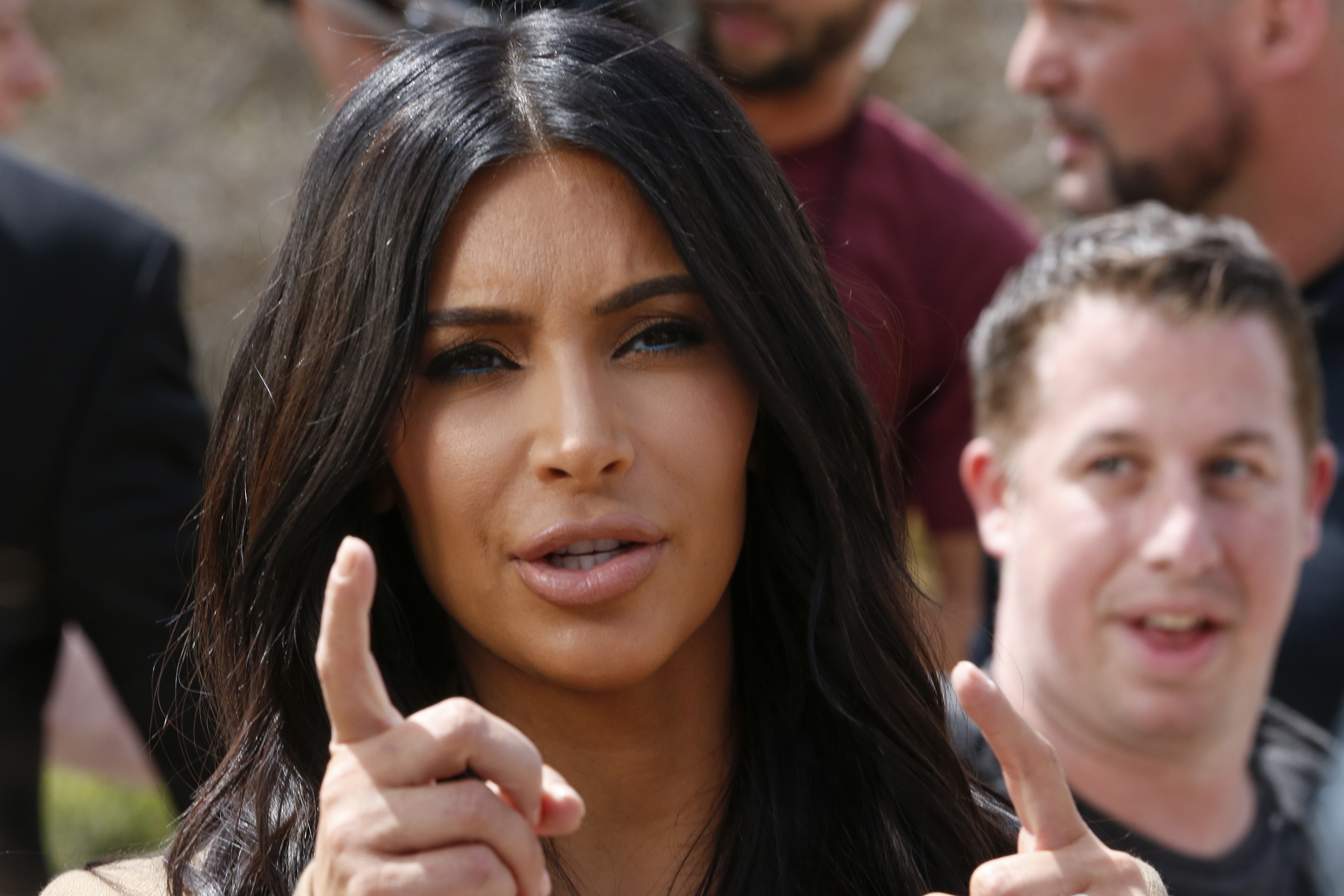 Kim Kardashian gestures while filming in Yerevan, Armenia, Thursday, April 9, 2015. The Kardashian family arrived on Wednesday in the capital of their ancestral Armenia and earlier on Thursday met with Armenian Prime Minister Hovik Abrahamyan (AP photo/Artur Harutyunyan, PAN Photo)