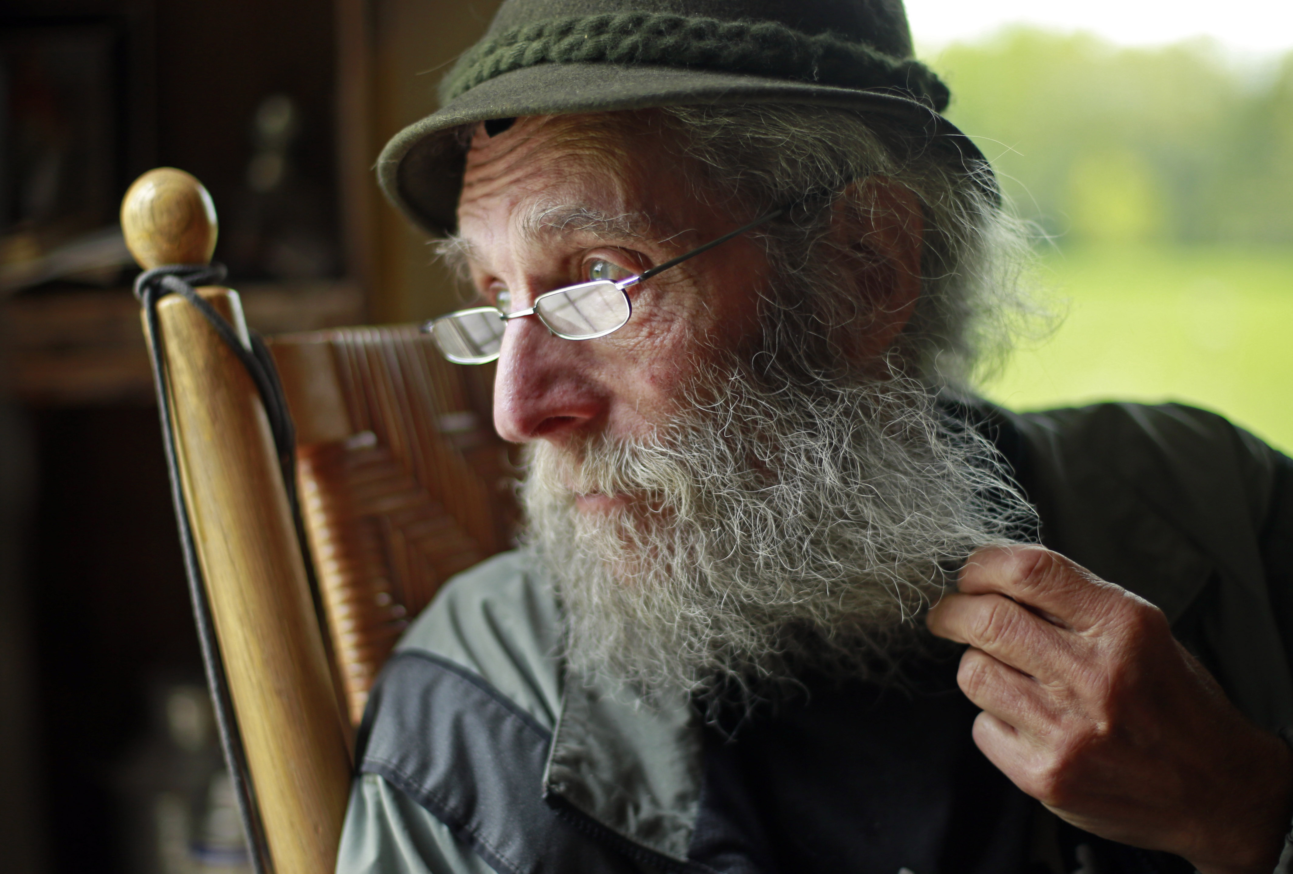  In a May 23, 2014, file photo, Burt Shavitz pauses during an interview to watch a litter of fox kits play near his camp in Parkman, Maine. Shavitz, a former beekeeper, is the Burt behind Burt's Bees. A spokeswoman for Burt’s Bees said Shavtiz died Sunday, July 5, 2015, at his home in rural Maine. He was 80. (AP Photo/Robert F. Bukaty, File)