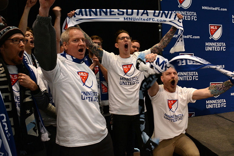 Soccer fans celebrate the announcement that Minnesota is getting a Major League Soccer franchise at a league press conference at Target Field in March. Photo: Tim Nelson | MPR News