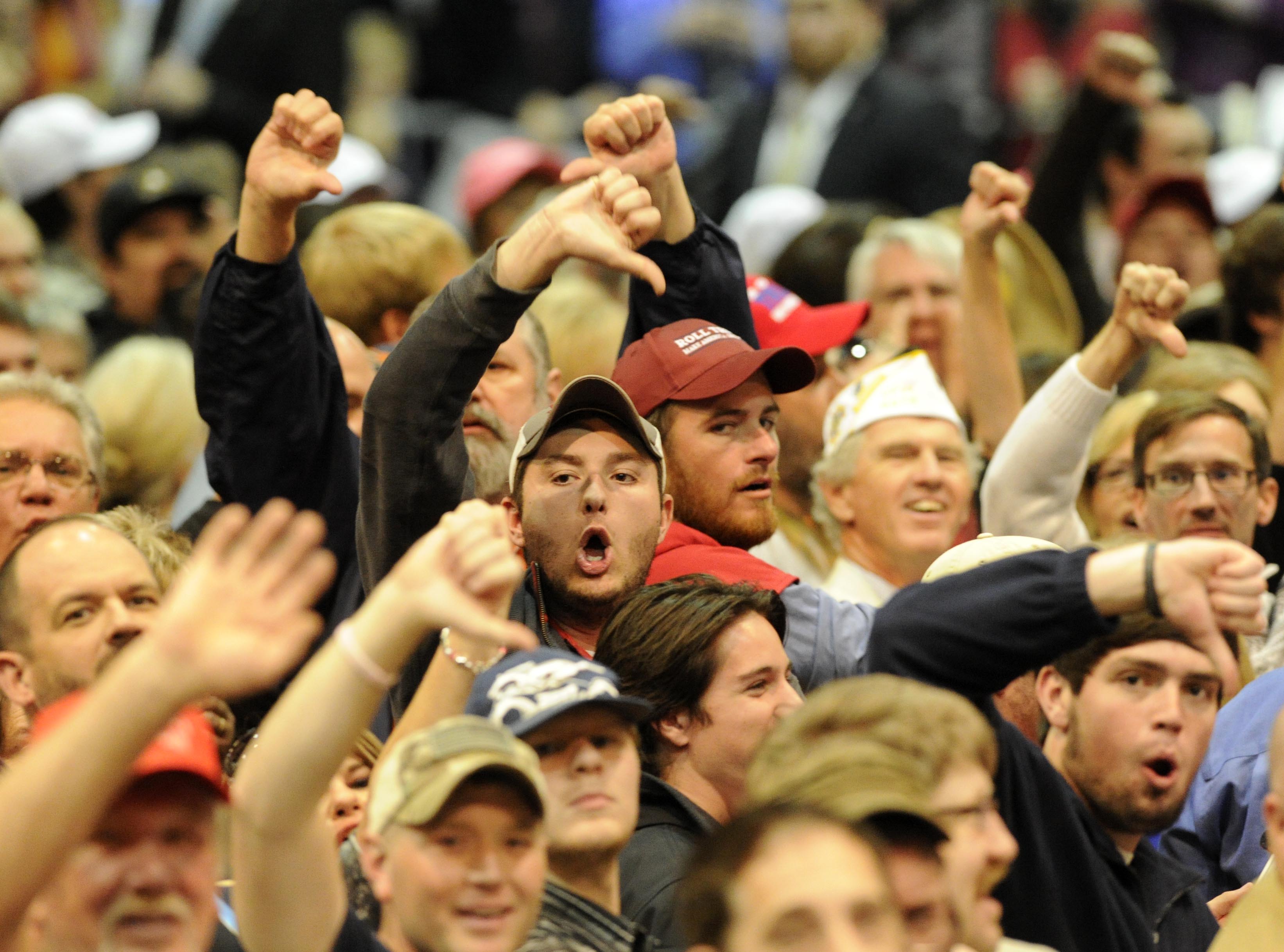 Trump supporters 'boo' the media after a heckler was removed as Republican presidential candidate Donald Trump speaks during a campaign stop Saturday, Nov. 21, 2015 in Birmingham, Ala. (AP Photo/Eric Schultz)