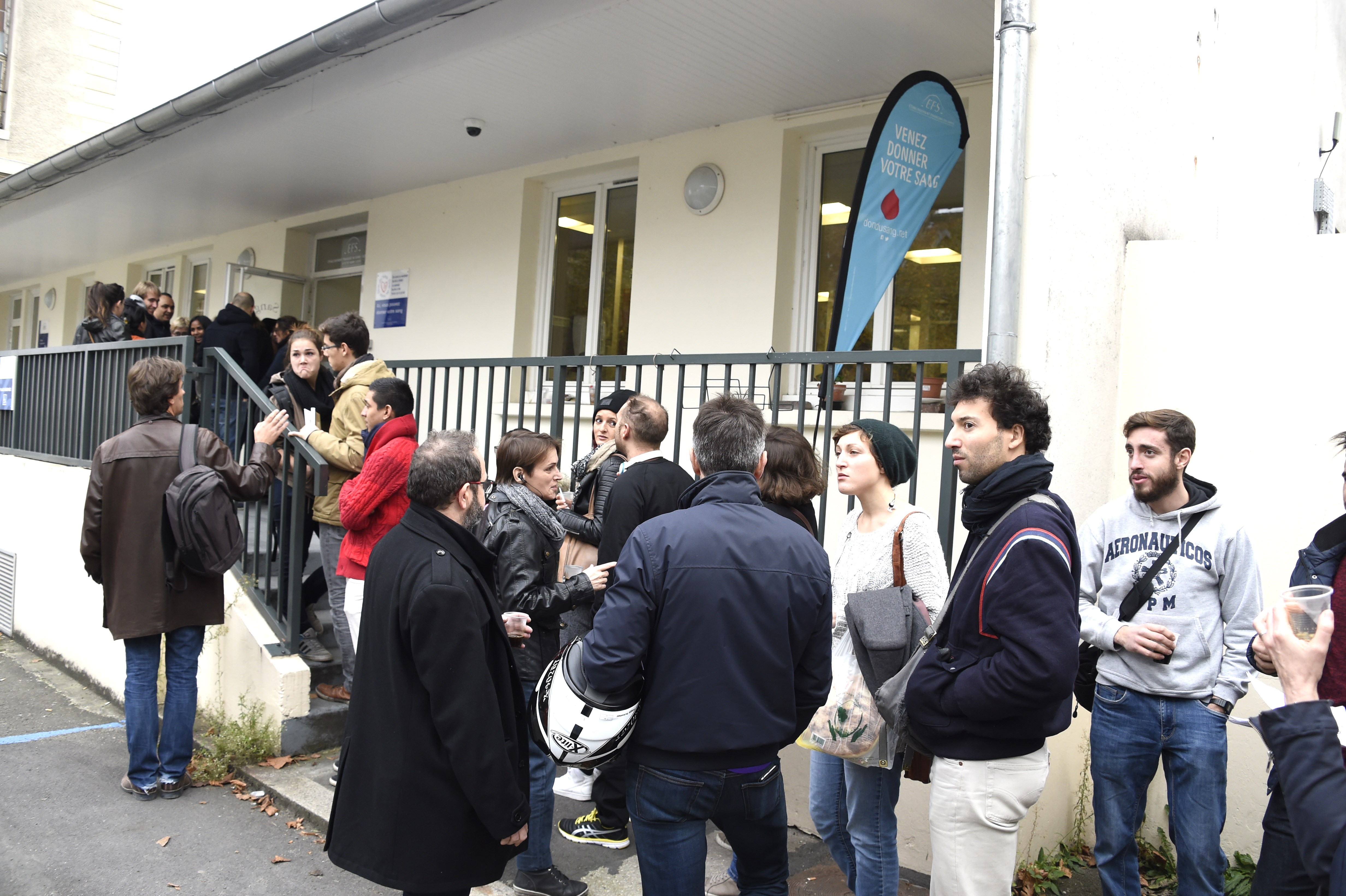 People wait to donate blood at the Hopital Saint Louis in Paris, on November 14, 2015, the morning a total of six separate attacks killed at least 128 people in the capital, one targeting the national stadium where the French and German national football teams were playing a friendly. AFP PHOTO / DOMINIQUE FAGET        (Photo credit should read DOMINIQUE FAGET/AFP/Getty Images)