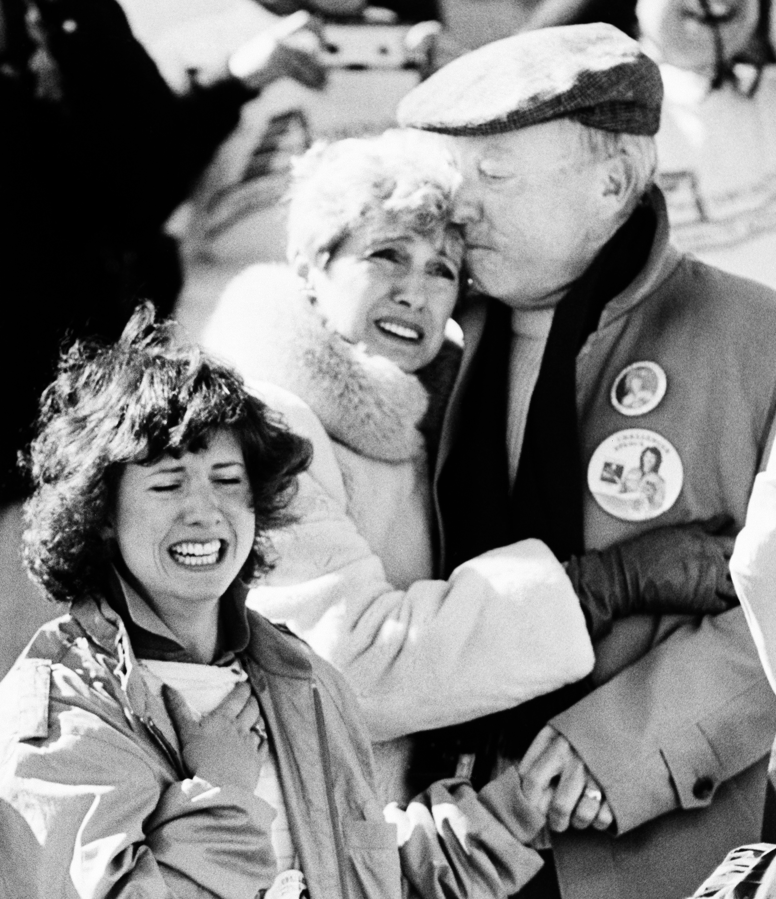 The family of Christa McAuliffe, a teacher who was America's first astronaut, realize the horror after the Space Shuttle orbiter Challenger blew apart after liftoff from Kennedy Space Center, Florida, Tuesday, Jan. 28, 1986. The sister of Christa, Betsy, left, and parents Grace and Ed Corrigan console each other after the explosion. (AP Photo/Jim Cole)