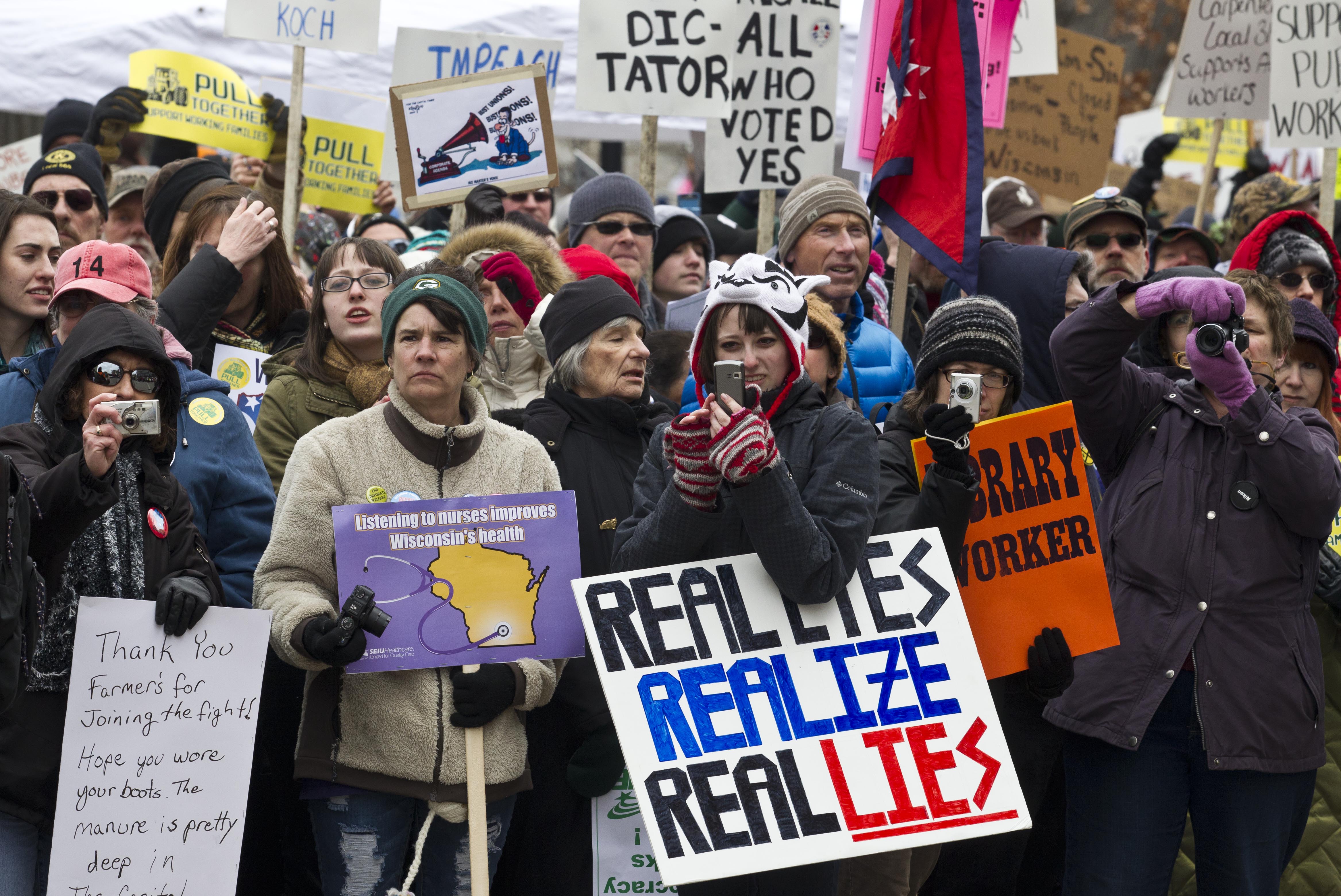 Protesters march outside the state Capitol in Madison, Wis., Saturday, March 12, 2011.  AP Photo/Morry Gash.