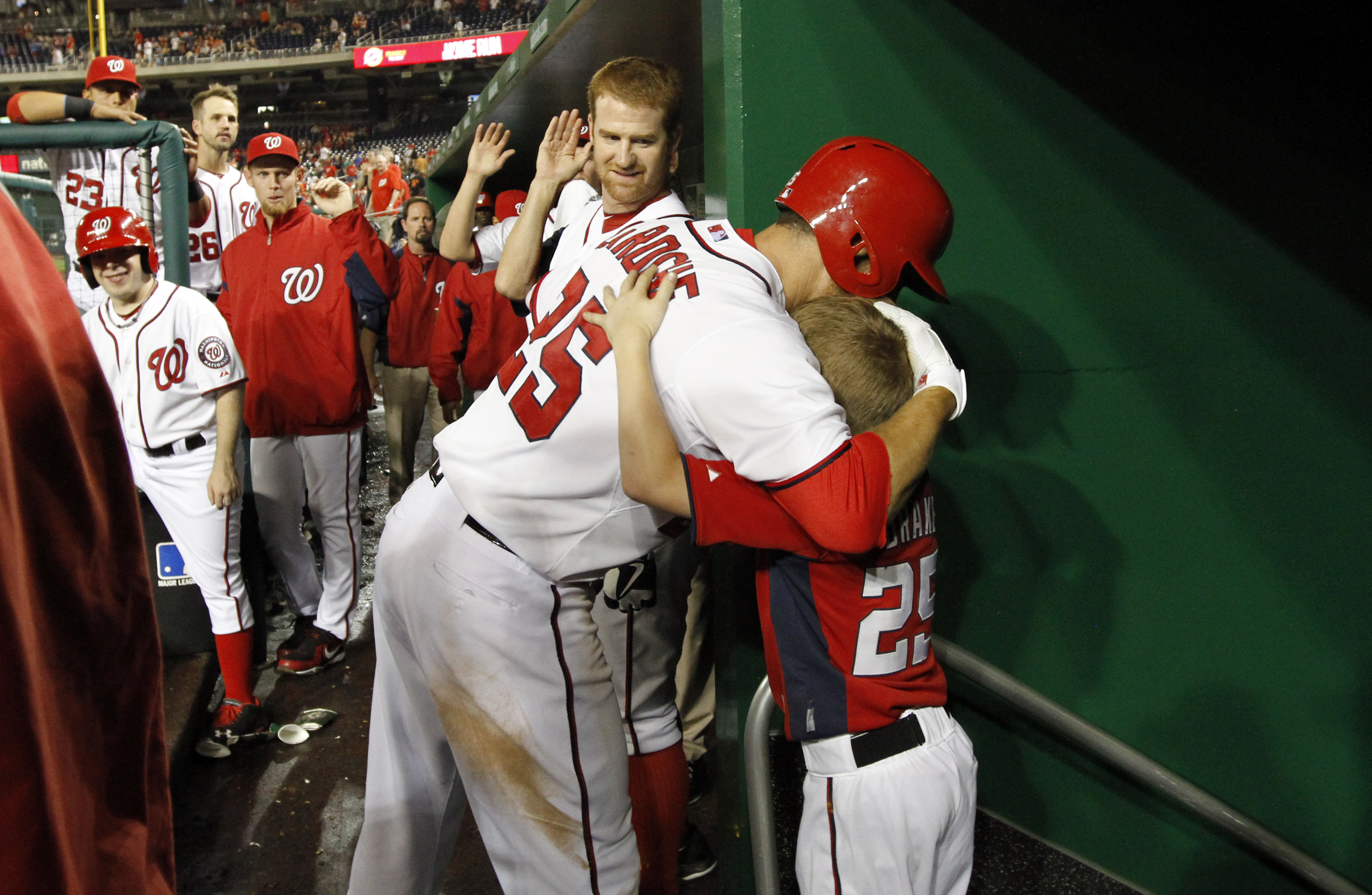 In this 2013 photo, Adam LaRoche  hugs his son Drake after a home run . AP Photo/Alex Brandon/File.