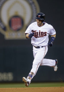 Minnesota Twins' Brian Dozier runs the bases on a solo home run off Kansas City Royals pitcher Dillon Gee during the first inning of a baseball game Tuesday, Sept. 6, 2016, in Minneapolis. (AP Photo/Jim Mone)