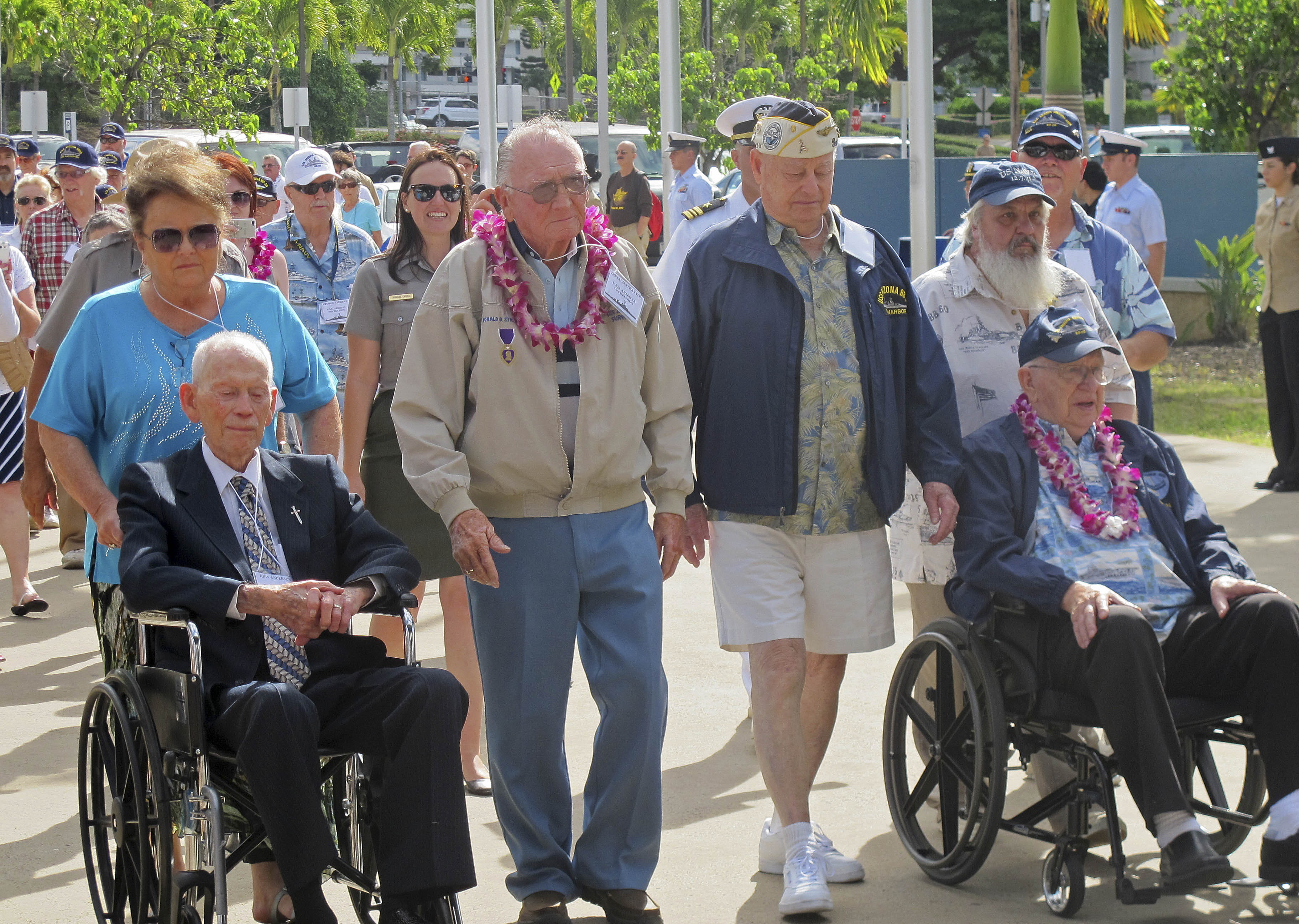 USS Arizona survivors from left, John Anderson, Don Stratton, Louis Conter and Lauren Bruner arrive Tuesday, Dec. 2, 2014, in Pearl Harbor, Hawaii. (AP Photo/Audrey McAvoy)