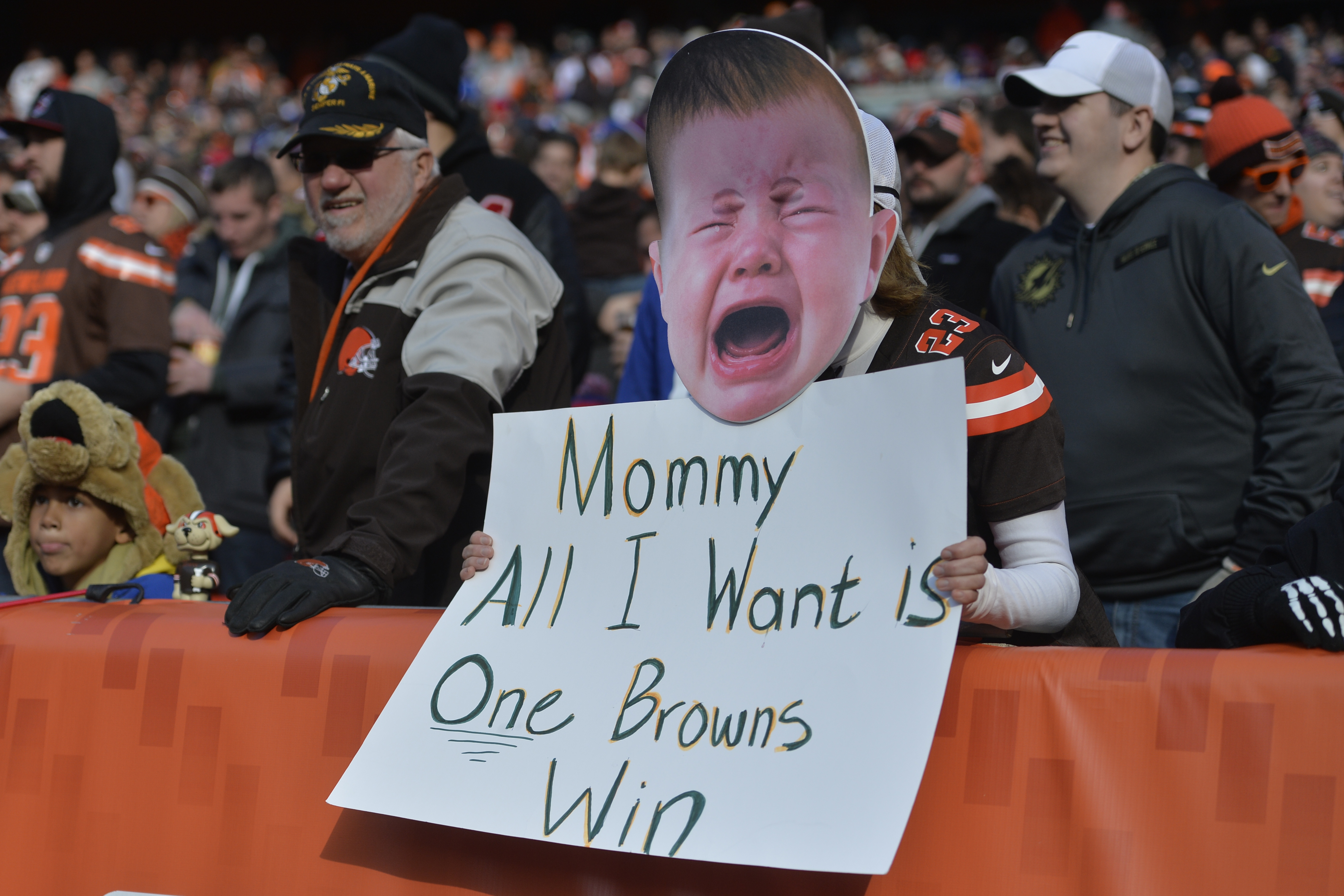 A fan holds a sign referring to the Cleveland Browns' winless season during an NFL football game between the Browns and the New York Giants, Sunday, Nov. 27, 2016, in Cleveland. AP Photo | David Richard.