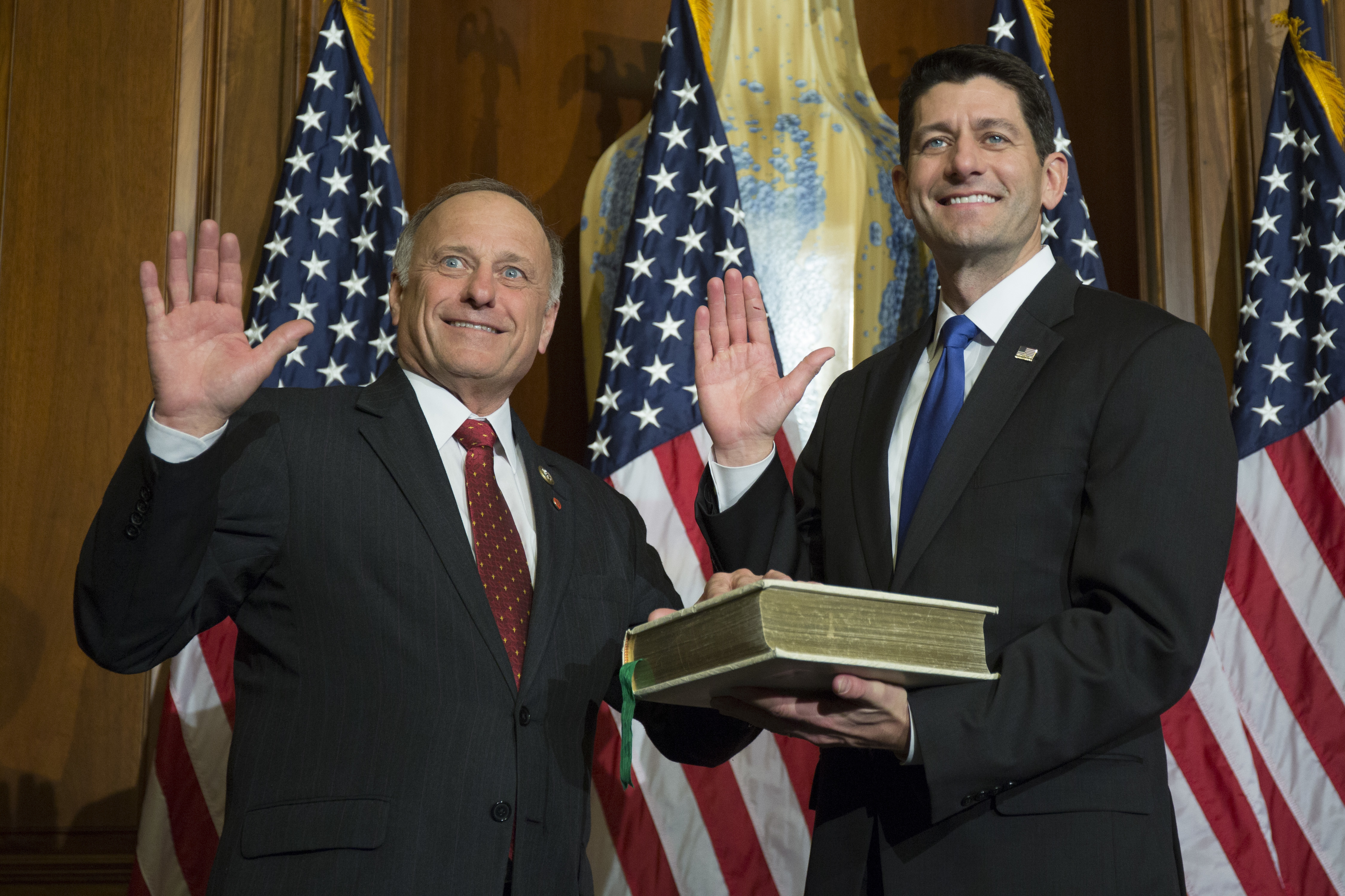 House Speaker Paul Ryan of Wis. administers the House oath of office to Rep. Steve King, R-Iowa., during a mock swearing in ceremony on Capitol Hill in Washington, Tuesday, Jan. 3, 2017. (AP Photo/Zach Gibson)