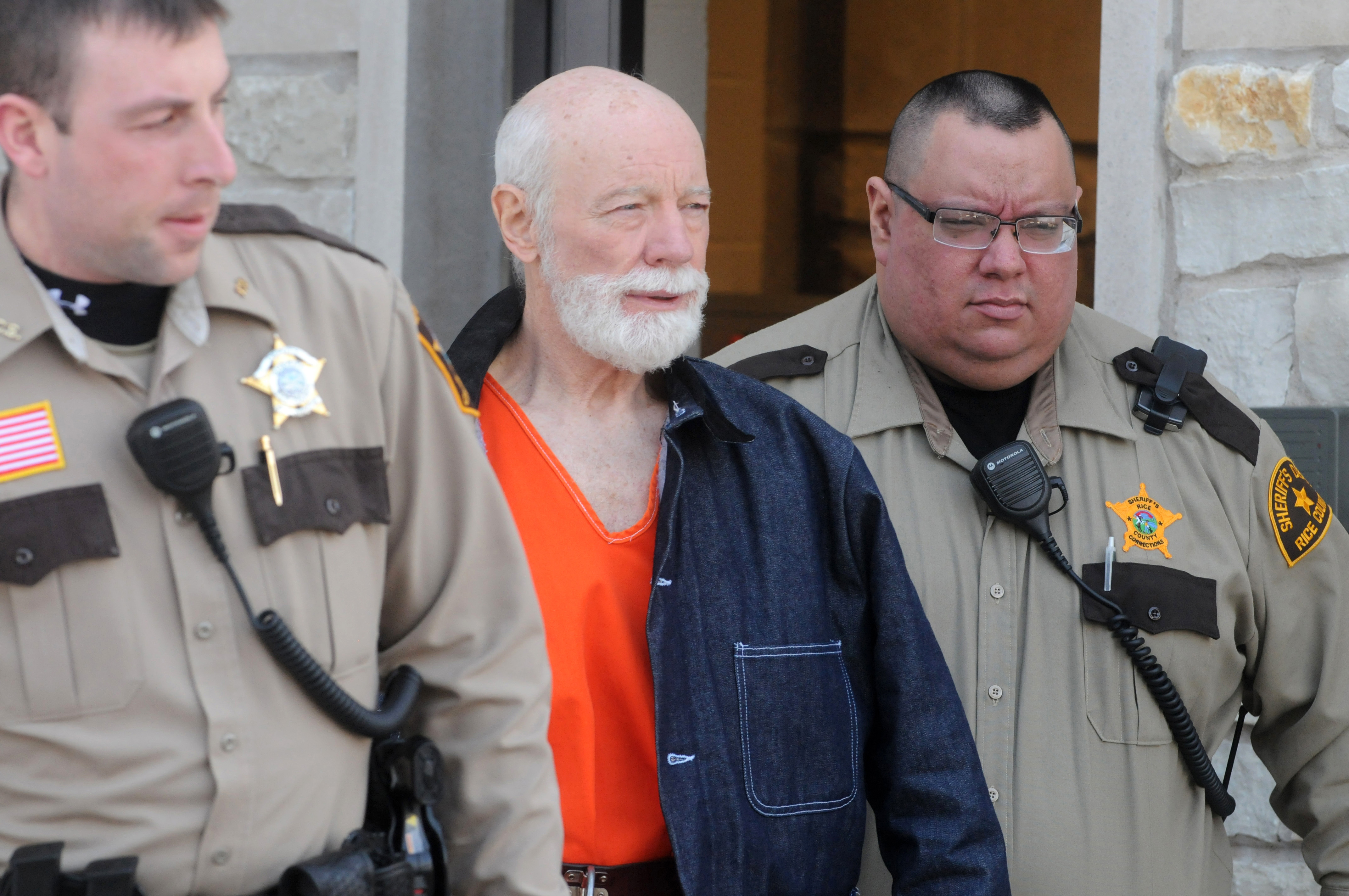 Lynn Seibel is escorted out of the Rice County Courthouse on Tuesday, Feb. 26, 2013, after his first appearance on 17 felony charges, in Faribault, Minn. A judge set bail at $200,000 with no conditions or $100,000 with conditions. (AP Photo/The Daily News, Cristeta Boarini)