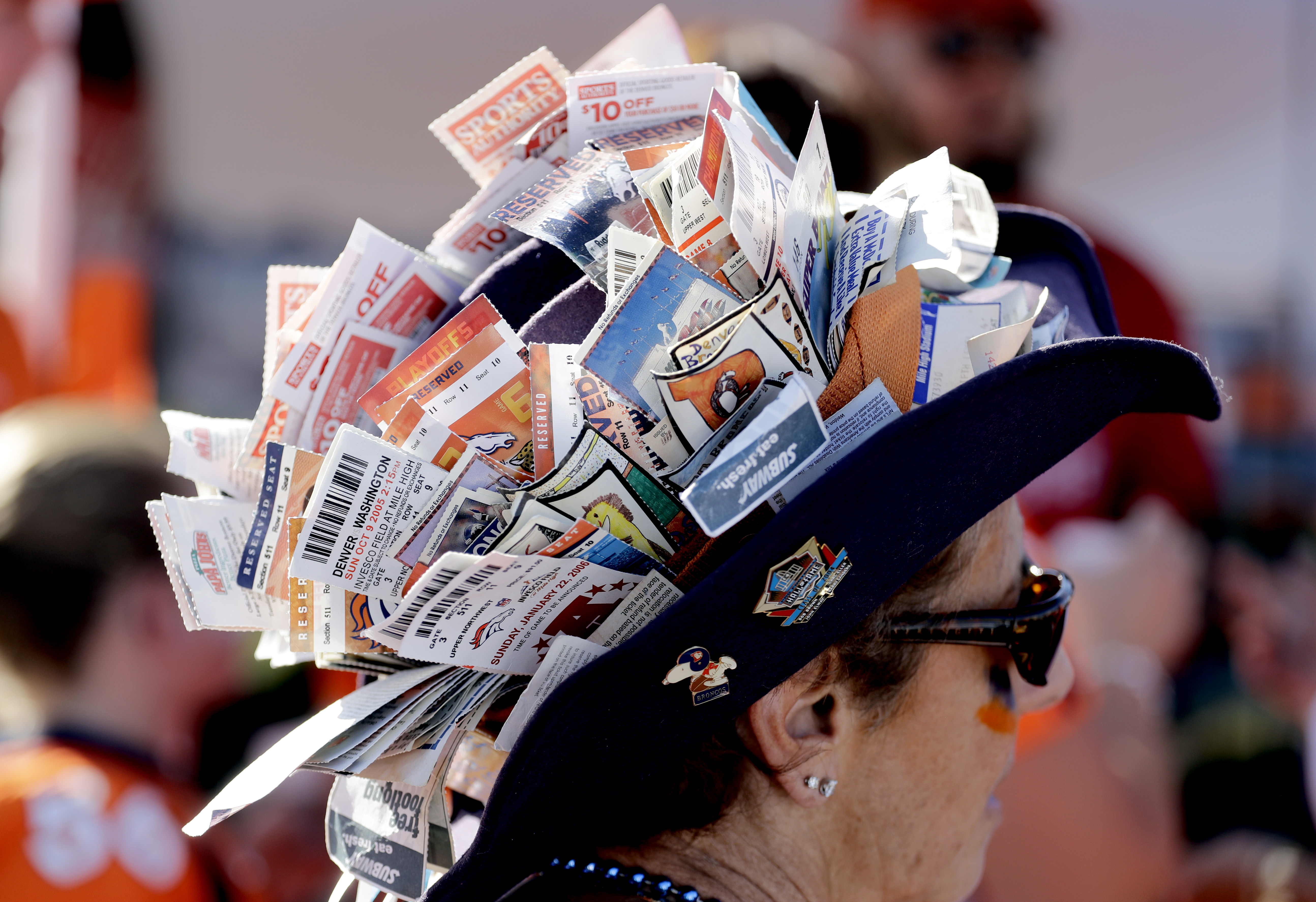 Denver Broncos fan Sherri Adams wears used game tickets on her hat from the past 45 seasons. AP Photo | Jack Dempsey | File.