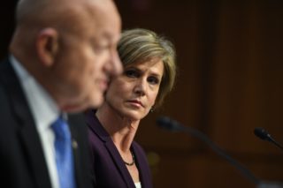 Former acting Attorney General Sally Yates (R) listens as former Director of National Intelligence James Clapper testifies on May 8, 2017, before the US Senate Judiciary Committee. Jim Watson | AFP | Getty Images.